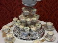 Floral wedding cupcakes with teapot top cake