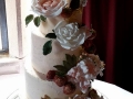 Buttercream, gilded fruit and florals cake